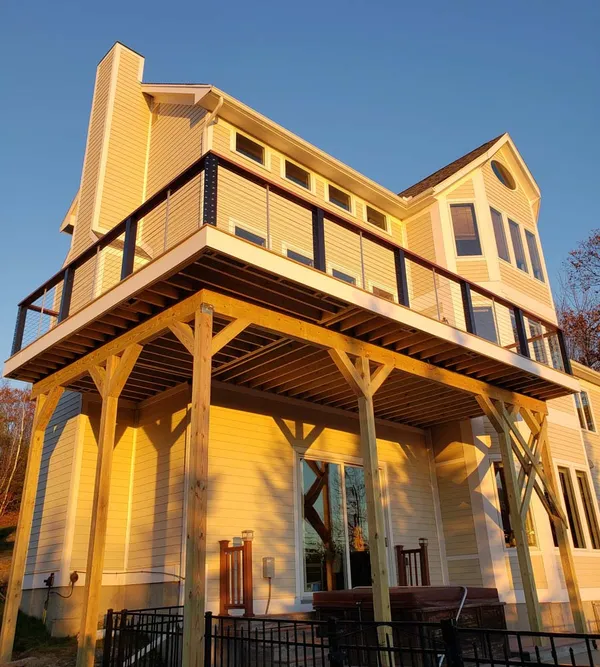 This deck was 19.6 feet off the ground and trex decking was used with timber tech sleeves and stainless steel cable